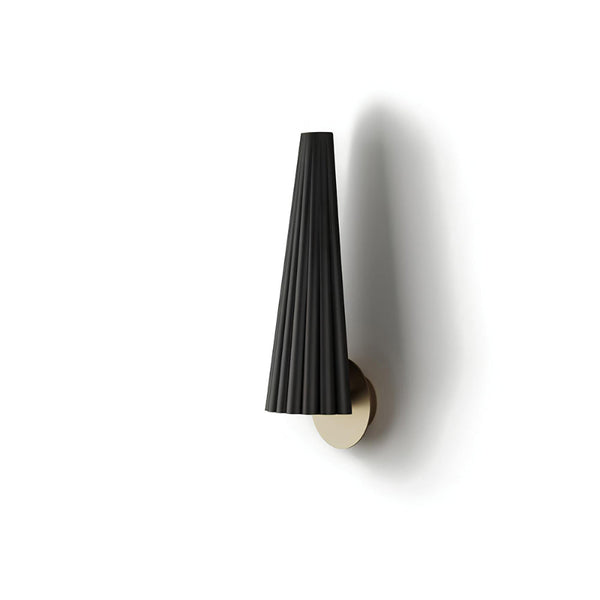 Black wall-mounted lamp with gold base on a white background