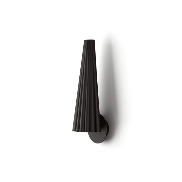 Black wall-mounted lamp with a textured design on a white background