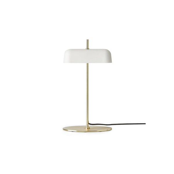 A white globe desk lamp with a gold-colored base, switched on, against a plain background.