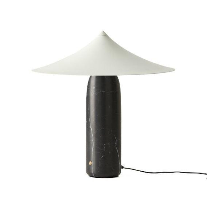 Table lamp with a black base and white shade on a white background