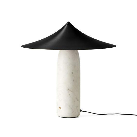 Table lamp with black conical shade and marble base on a white background