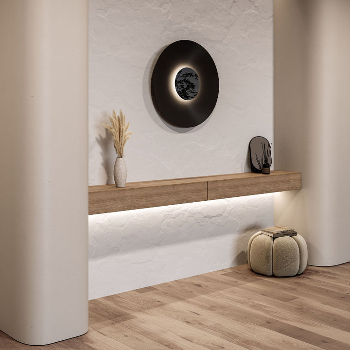 Modern interior design with a wall-mounted shelf, decorative items, and a textured wall.