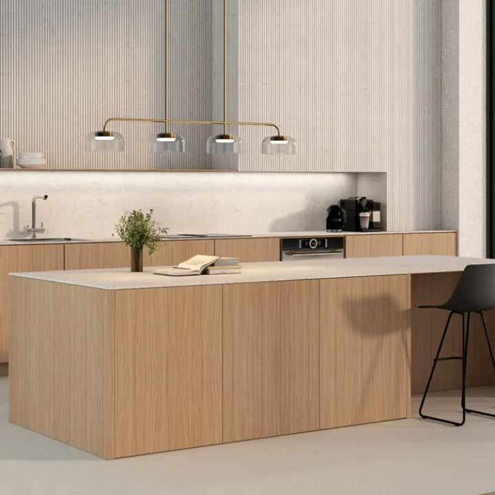 Modern kitchen with wooden island and light-colored cabinets by Bazar Mondiale