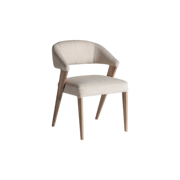Bella dining chair in beige polyester and oak wood – front view. Only at Bazar Mondiale high end furniture and exclusive pieces.