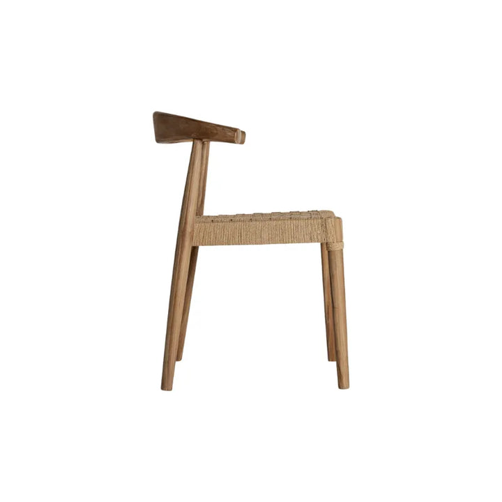 Back angle view of Figeac vintage teak dining chair. Only at Bazar Mondiale high end furniture and exclusive pieces.