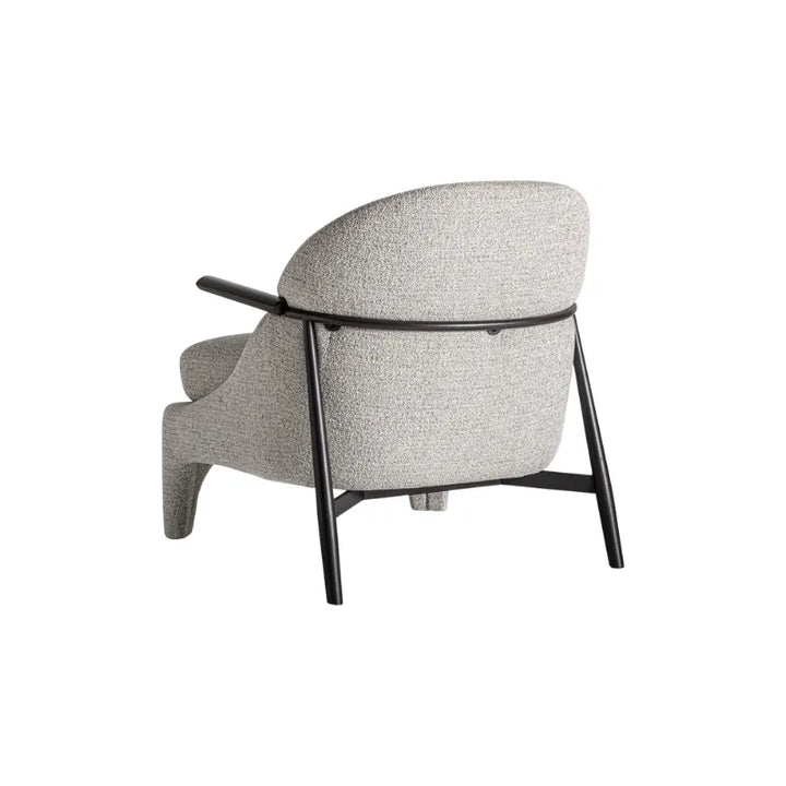 Front view of Herzele Armchair with curved grey body and brown cushion. Only at Bazar Mondiale high end furniture and exclusive pieces.