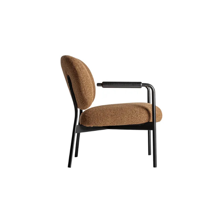 Rear view of Jessie Armchair with curved ochre seat and slim black metal legs. Only at Bazar Mondiale high end furniture and exclusive pieces.