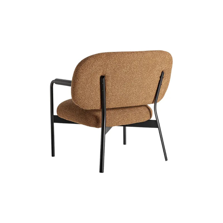 Side view of Jessie Armchair with minimalist tubular frame and angled back. Only at Bazar Mondiale high end furniture and exclusive pieces.