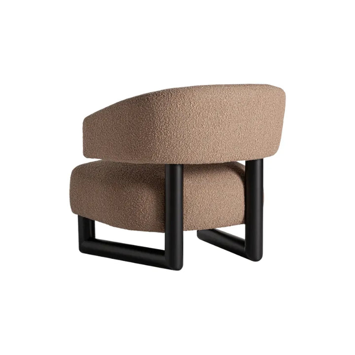 Side view of Irvin Armchair with cantilevered cushion profile