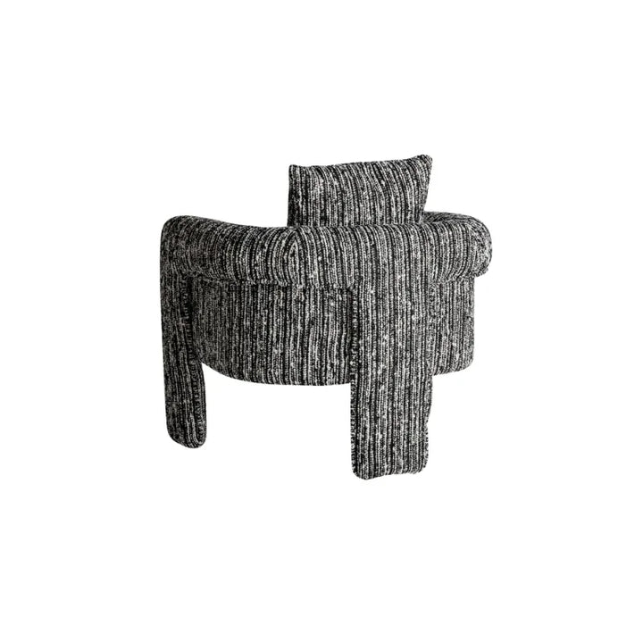 Side angle of Kostov Armchair with soft lines and full fabric cover.Only at Bazar Mondiale high end furniture and exclusive pieces.