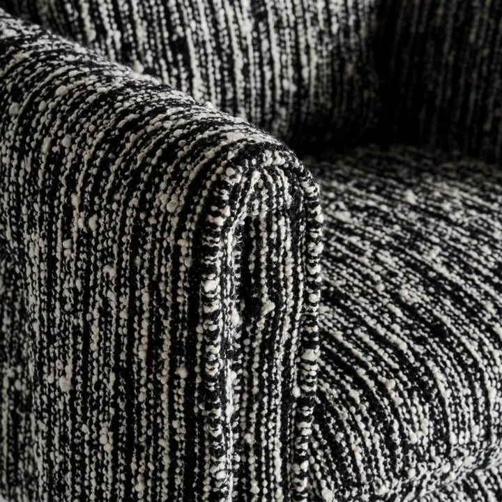 Three-quarter view of Kostov Armchair emphasizing form and structure. Only at Bazar Mondiale high end furniture and exclusive pieces.