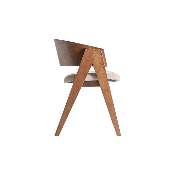 Side profile showcasing the angular legs and carved arm detail – Only at Bazar Mondiale high end furniture and exclusive pieces.