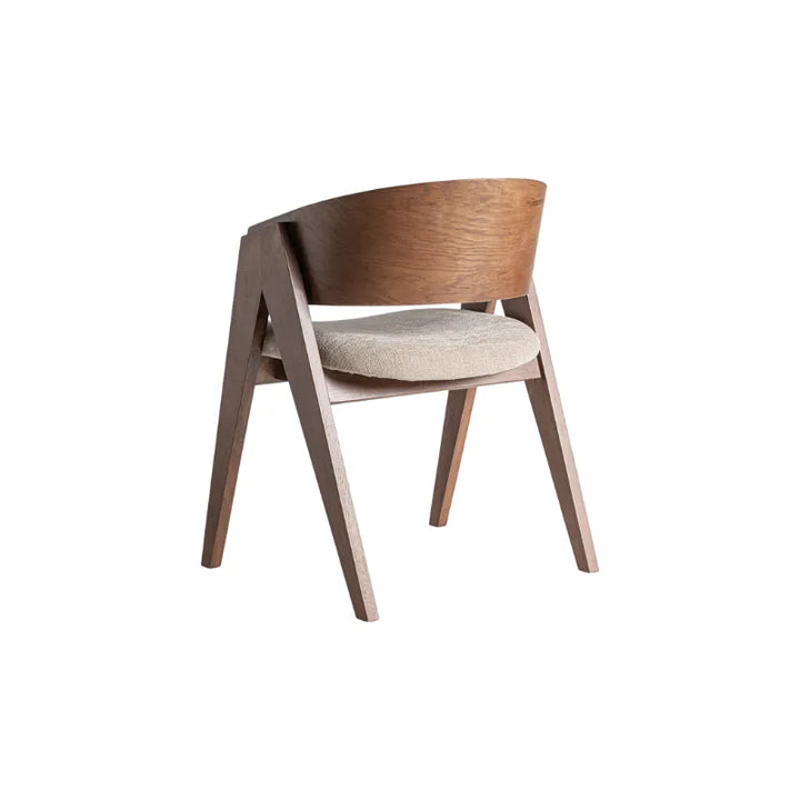 Back diagonal perspective of the Madiran chair showing sculptural silhouette – Only at Bazar Mondiale high end furniture and exclusive pieces.