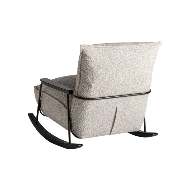 Front view of Zw Armchair with generous beige cushion and clean silhouette. Only at Bazar Mondiale high end furniture and exclusive pieces.