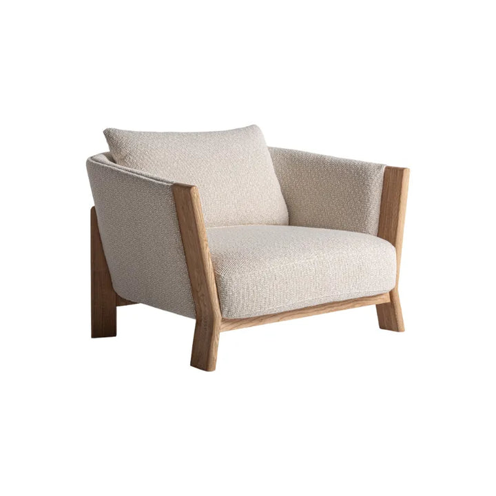 Nara light armchair front view with curved backrest – Only at Bazar Mondiale high end furniture and exclusive pieces. Only at Bazar Mondiale high end furniture and exclusive pieces.