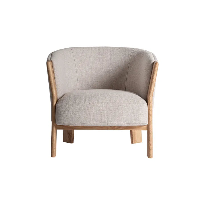 Side profile of Nara armchair showing ergonomic brown polyester seat – Only at Bazar Mondiale high end furniture and exclusive pieces. Only at Bazar Mondiale high end furniture and exclusive pieces.