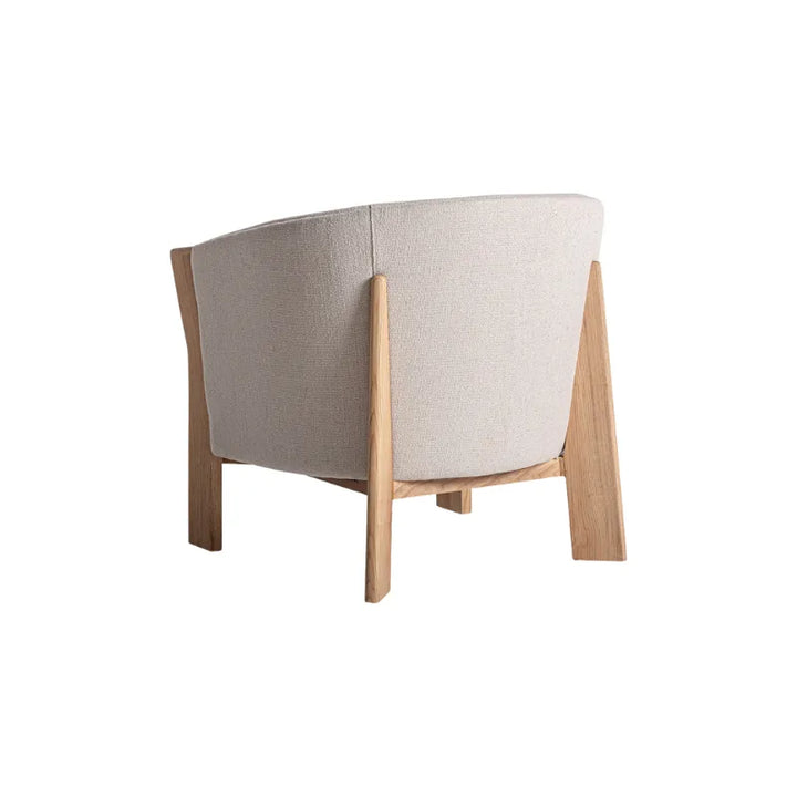 Back view of the Nara minimalist armchair by Francesc Rifé – Only at Bazar Mondiale high end furniture and exclusive pieces. Only at Bazar Mondiale high end furniture and exclusive pieces.