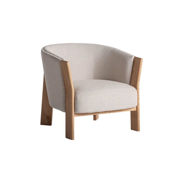 Nara light armchair front view with curved backrest – Only at Bazar Mondiale high end furniture and exclusive pieces. Only at Bazar Mondiale high end furniture and exclusive pieces.