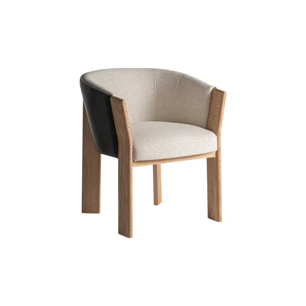 Front view of the Nara BW chair with beige fabric and black faux leather backrest – Only at Bazar Mondiale high end furniture and exclusive pieces.