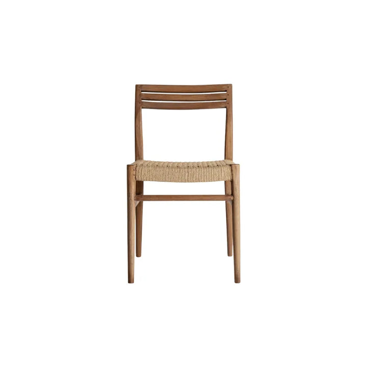 Side profile of Souillac dining chair showing curved lines and artisan rope seat — Bazar Mondiale high end furniture and exclusive pieces.